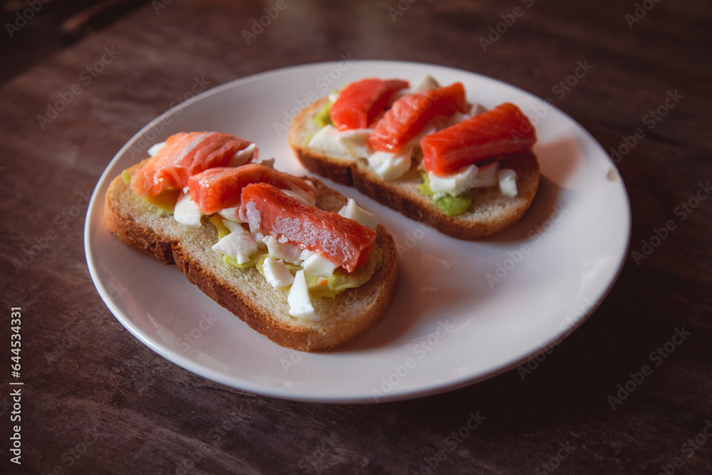 Homemade sandwich with fish and avocado