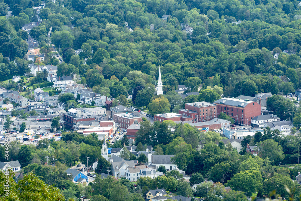 The town of Camden Maine from the top of a mountain on a humid summer day