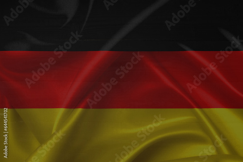 German flag over a grunge wooden background. Tag der Deutschen Einheit.