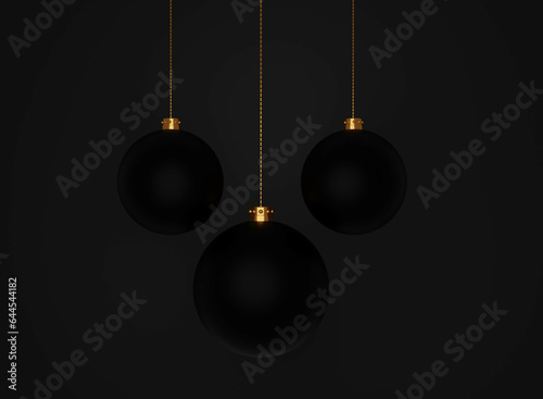 Trzy czarne bombki świąteczne na czarnym tle