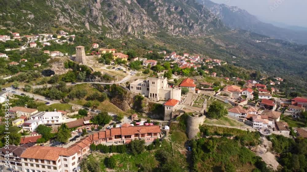 Kruje Castle and its fortress seen from an aerial drone view, tower and the Kruje museum with the mountains in the background. Albania. Right turn pan Kruje Castle and its fortress seen from an aerial drone view, tower and the Kruje museum with the mountains in the background. Albania. Right turn pan
