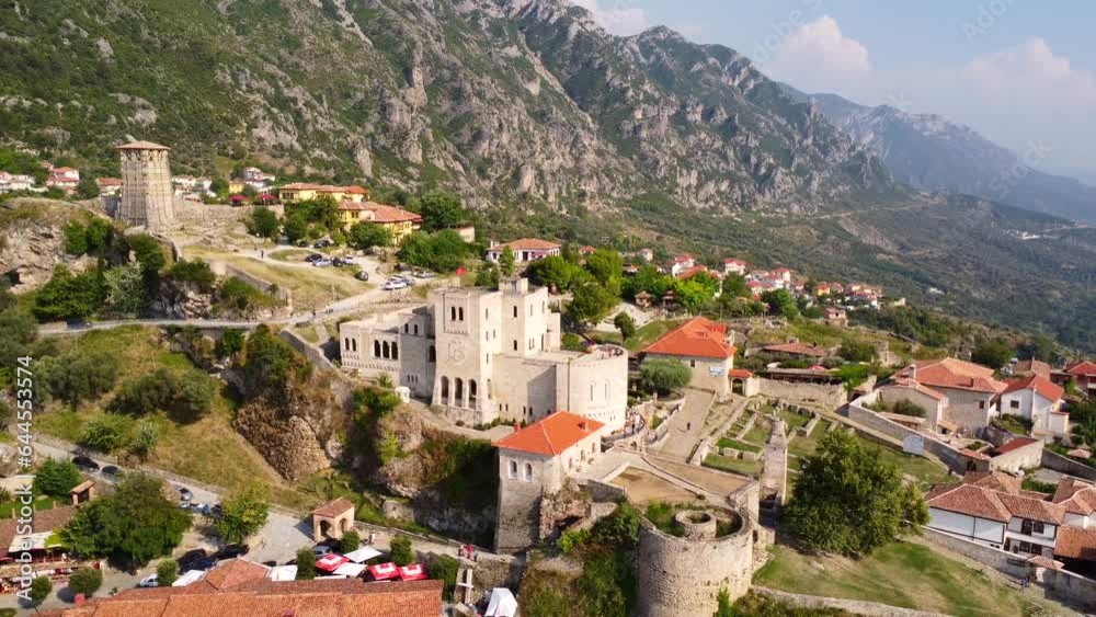 Kruje Castle and its fortress seen from an aerial drone view, tower and the Kruje museum with the mountains in the background. Albania. Panning up and down Kruje Castle and its fortress seen from an aerial drone view, tower and the Kruje museum with the mountains in the background. Albania. Panning up and down