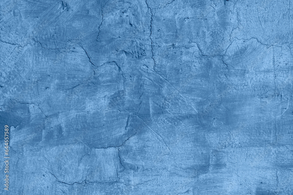Texture of old blue painted wall, chipped, scratches. Stucco wall. Natural vintage background