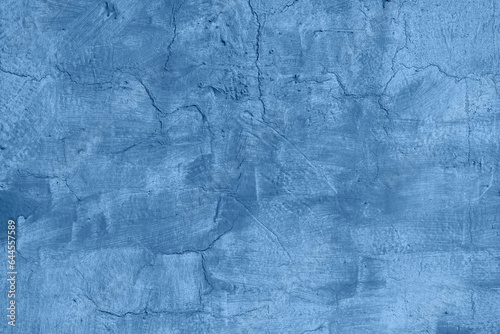 Texture of old blue painted wall  chipped  scratches. Stucco wall. Natural vintage background