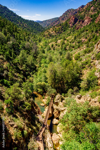 People swim in a pond in Pine Creek at Tonto Natural Bridge State Park in Payson Arizona photo