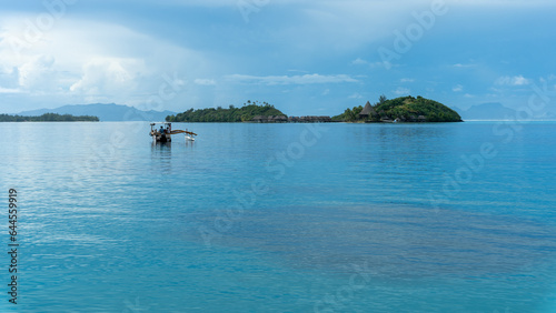 Bora Bora, Calm Lagoon with two Islands before Storm with local Boat 