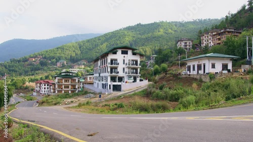 View of vehicles on a road in Thimphu city located in Bhutan photo