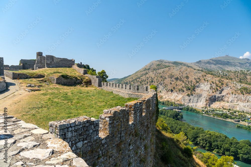 The walls of Rozafa Castle and its citadel in the city Shkoder along the lake river. Albania