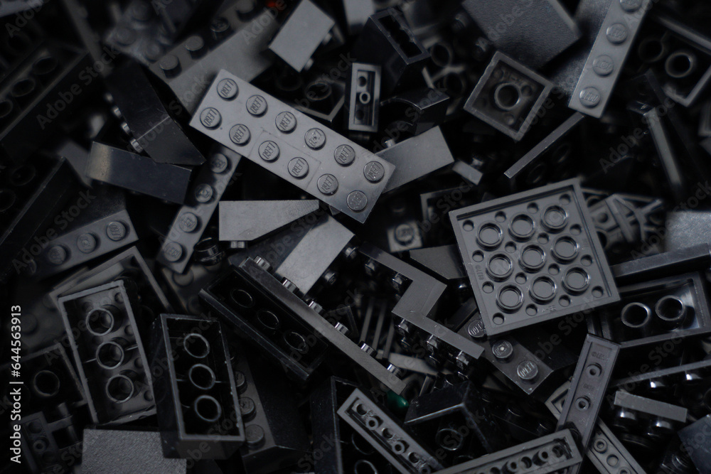 Fototapeta premium A collection of black building blocks legos on an acrylic box. 