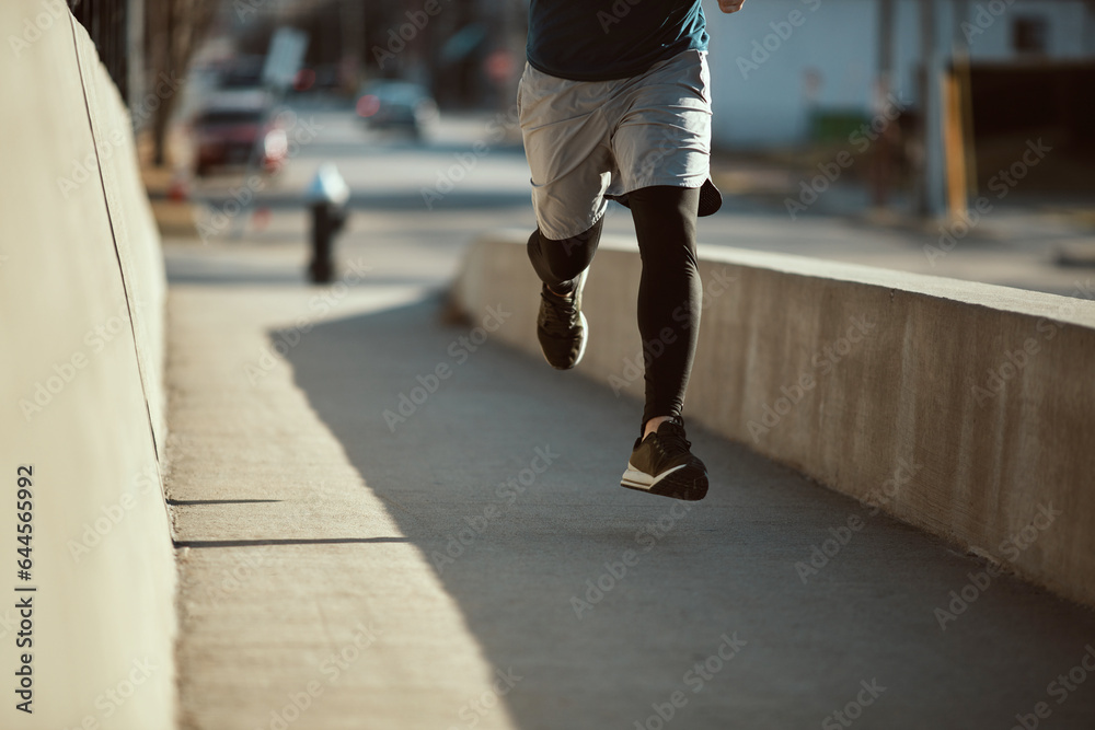 Young man running and exercising on a bridge in the City Young man running and exercising on a bridge in the City