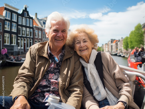 Canvastavla A Photo of Seniors Taking a Relaxed Canal Boat Tour in Amsterdam