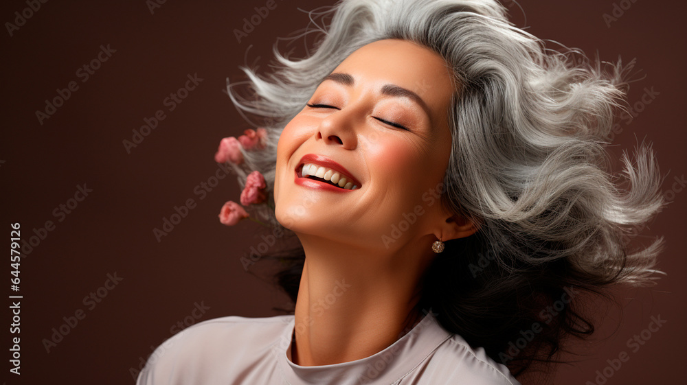  a woman with grey hair and a white shirt