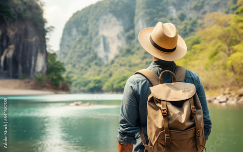 Young traveler wearing a hat with backpack hiking outdoor Travel Lifestyle and Adventure concept