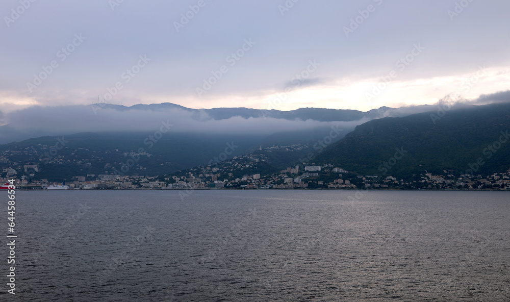 while you are arriving at the port of Bastia in Corsica during sunrise