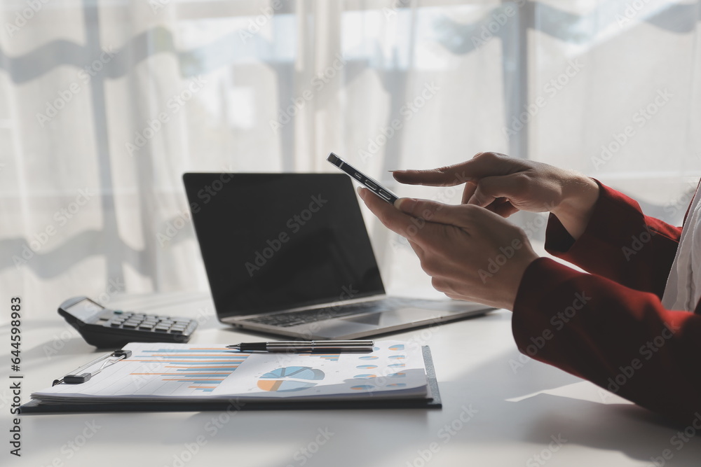 Naklejka premium Financial Business woman analyze the graph of the company's performance to create profits and growth, Market research reports and income statistics, data,repotr,Financial and Accounting concept.