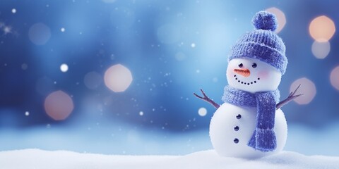 Christmas winter background with snowman in snow and blurred bokeh background.Merry Christmas and happy new year greeting card with copy space.