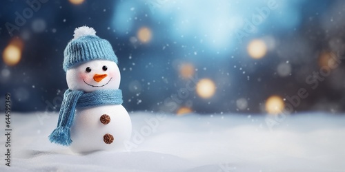 Christmas winter background with snowman in snow and blurred bokeh background.Merry Christmas and happy new year greeting card with copy space. © JW Studio