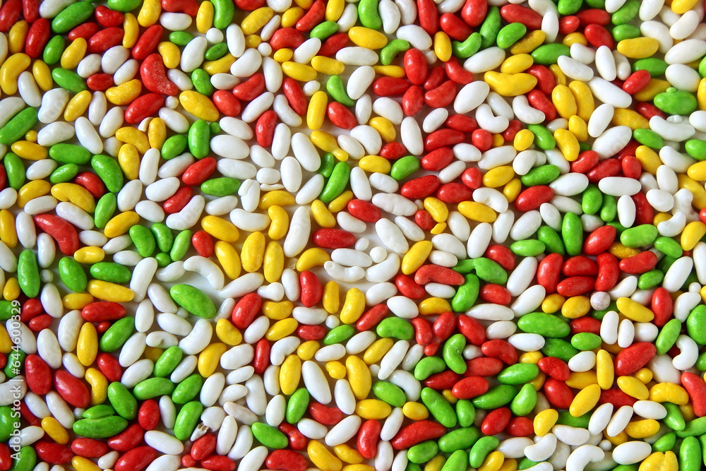 Sugar coated colorful Mouth Freshener fennel seeds candy also known in india as Saunf Goli,Indian Mukwas or Mukhvas as food texture background Sugar coated colorful Mouth Freshener fennel seeds candy also known in india as Saunf Goli,Indian Mukwas or Mukhvas as food texture background