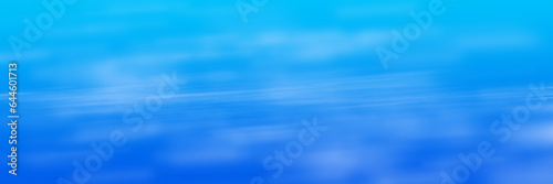 Blue background with fuzzy white glows in panoramic frame.
