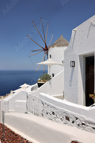 Whitewashed houses and windmill in Oia on Santorini island, Cyclades, Greece
