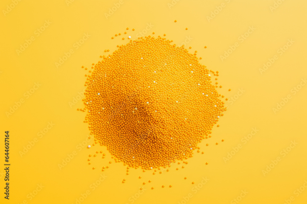Obraz premium Mustard seed spice on solid background.