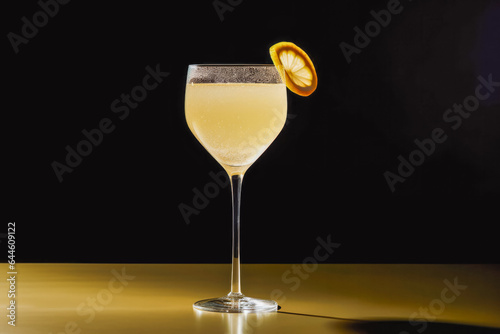 French 75 cocktail on solid background.