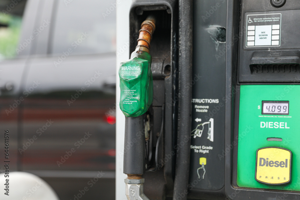 gas station with rising gas pump prices symbolizes the economic impact of inflation, oil industry challenges, and our dependence on fossil fuels. It's a snapshot of energy's cost 
