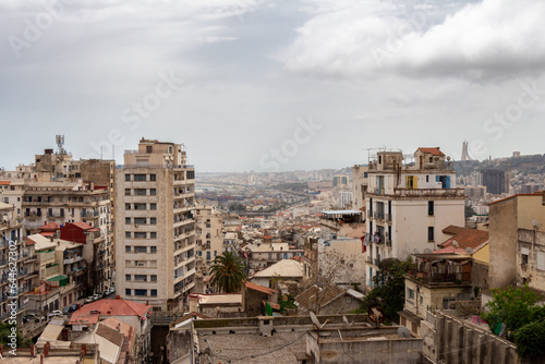 Panoramic view of old colonial white building on the heights of Algiers, Alger, Algeria. Cloudy sky.