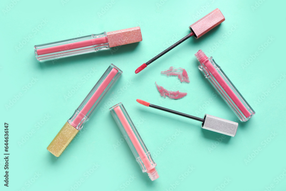 Liquid lipsticks and kiss mark on color background Liquid lipsticks and kiss mark on color background