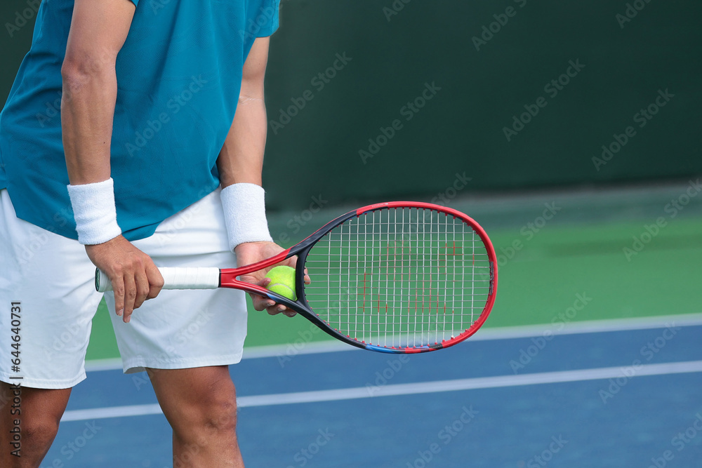 tennis player preparing to serve