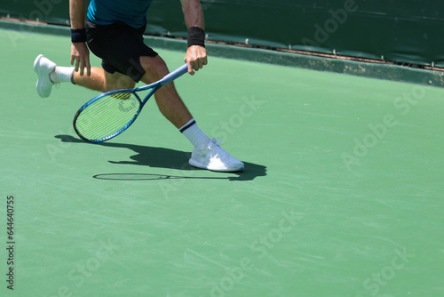 tennis player reaching for the ball, action shot © Teran