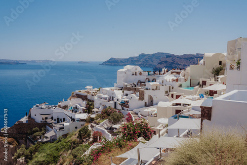 Aerial view of a coastal town in Santorini, Greece in summer on a sunny day.