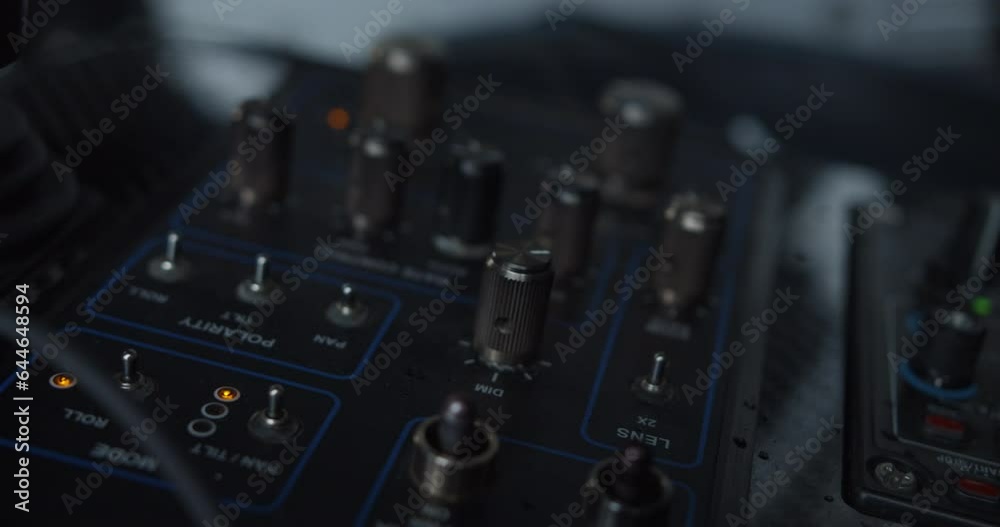 Rack focusing of control panel. Rows of knobs and switches for setting up and adjusting device. Selective focus. Airport and aviation concept Rack focusing of control panel. Rows of knobs and switches for setting up and adjusting device. Selective focus. Airport and aviation concept