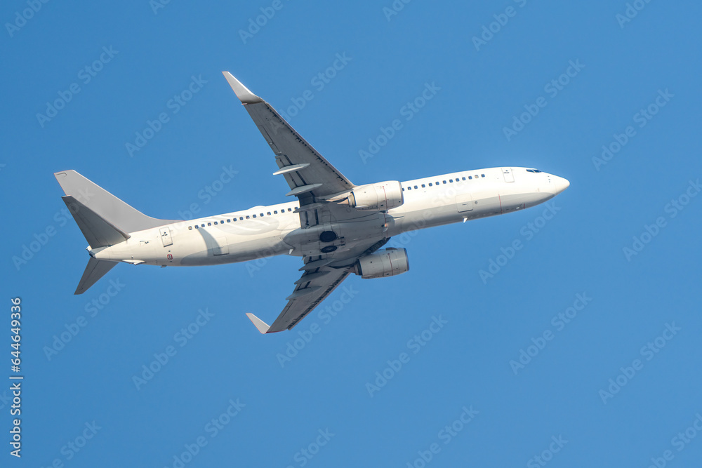 White passenger plane taking off White passenger plane taking off