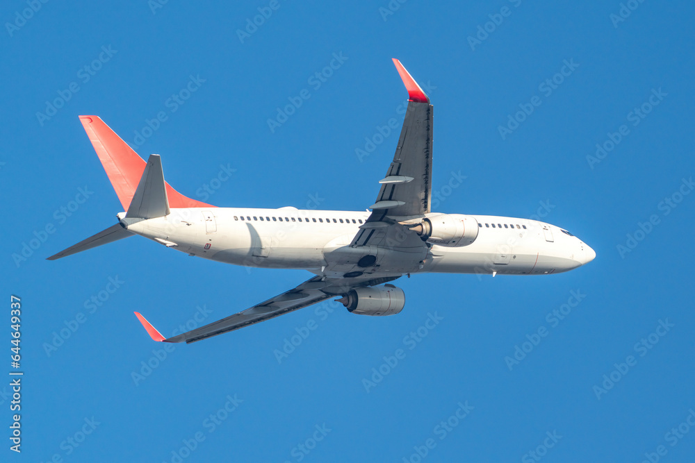 White passenger plane taking off White passenger plane taking off