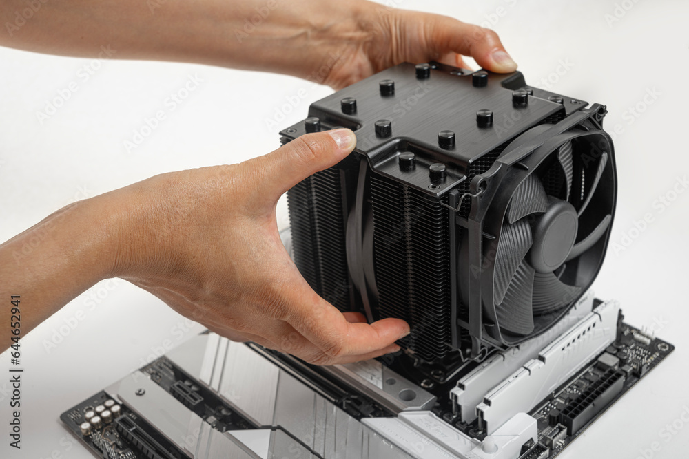 Fototapeta premium Installing a large air cooler on a computer processor.
