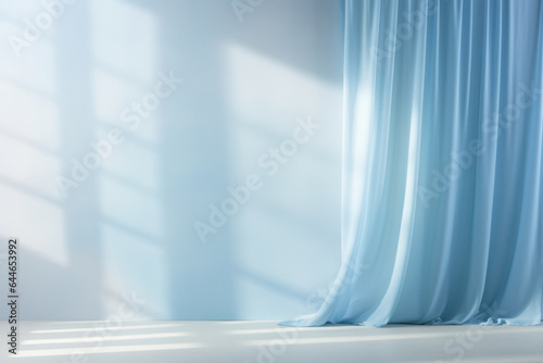 A peaceful and zenlike scene featuring a serene blue gradient background. The soft light filtering through curtains casts delicate shadows that create a soothing and calming ambiance, photo