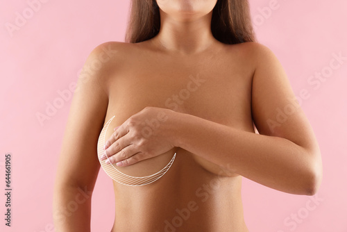 Woman with breast asymmetry on pink background, closeup photo