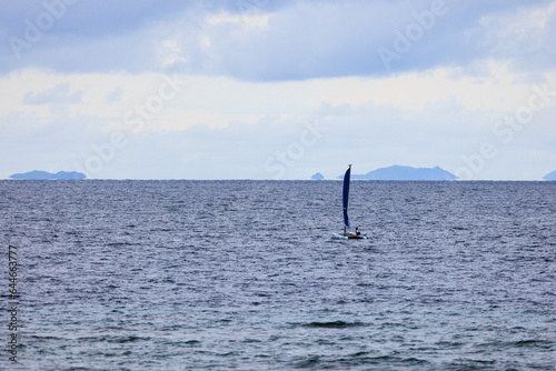 blue sailboat on the water fiji