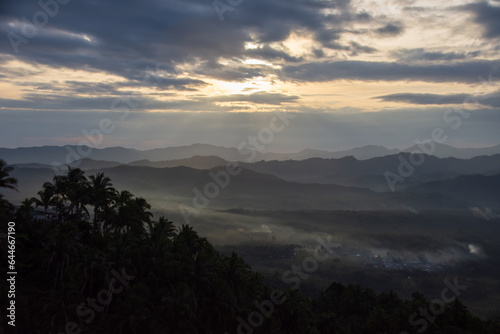Fog and clouds at dawn over the tropical forest