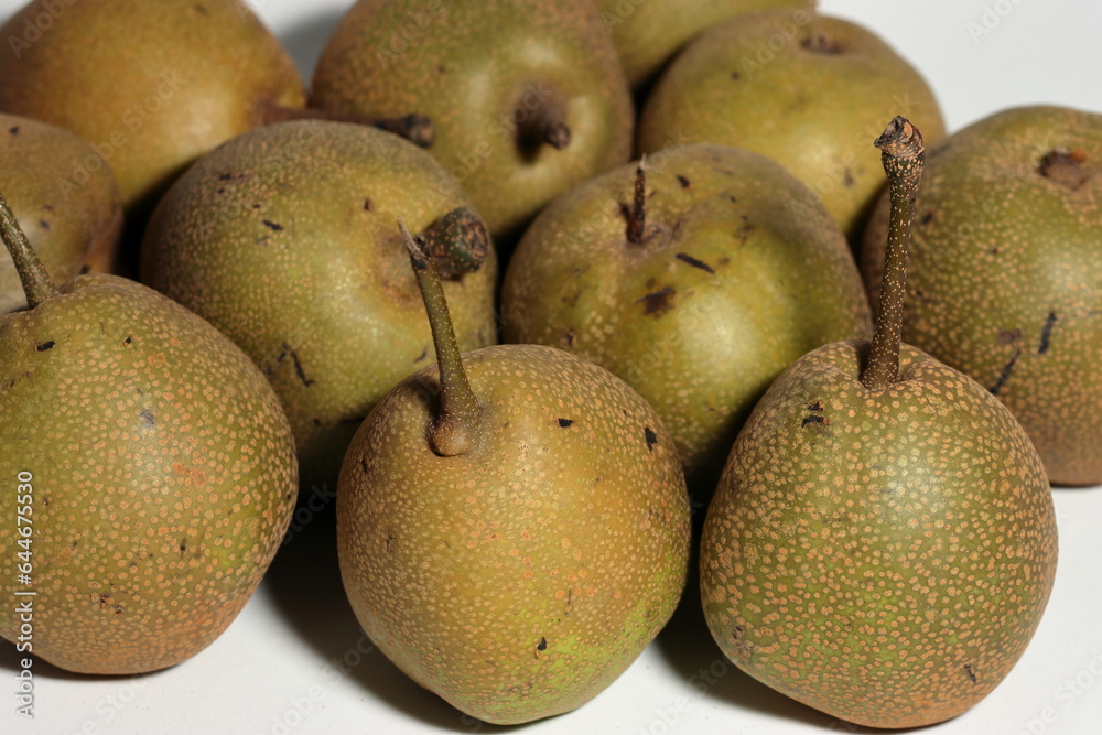 Fototapeta premium Crispy asian pears for sale in the outdoor farm market. Healthy Asian Pears on white background