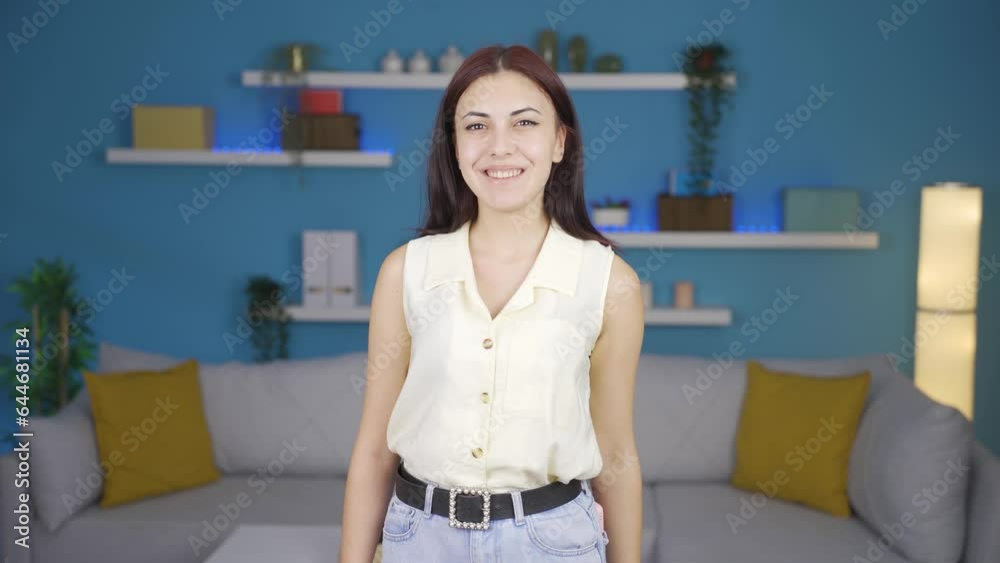 Happy woman waving at camera.