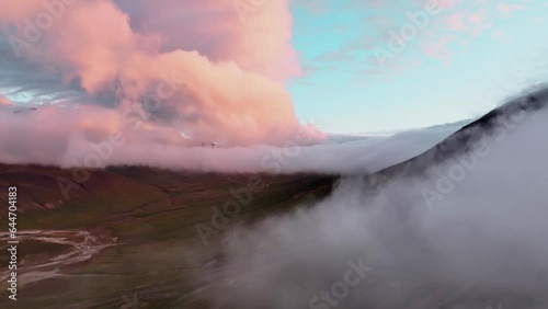 Billowing Clouds Over The Mountain  During Sunset In Borgafjordur Eystri, East Iceland. - aerial photo