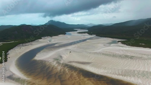 Stunning Reverse Aerial Shot Revealing The Beautiful Landscape Of Hill Inlet In Whitsundays National Park, Australia. photo