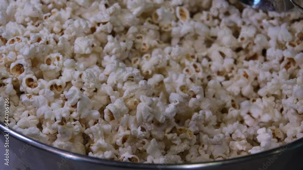 cooking popcorn at home in a special machine caramel. filling caramelized popcorn recipe close-up delicious treat for movie cooking popcorn at home in a special machine caramel. filling caramelized popcorn recipe close-up delicious treat for movie