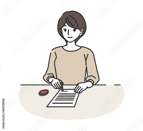 はんこを押す女性