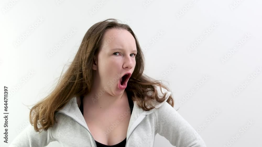 Young caucasian girl screaming into the camera. Slow motion. High quality 4k footage Young caucasian girl screaming into the camera. Slow motion. High quality 4k footage
