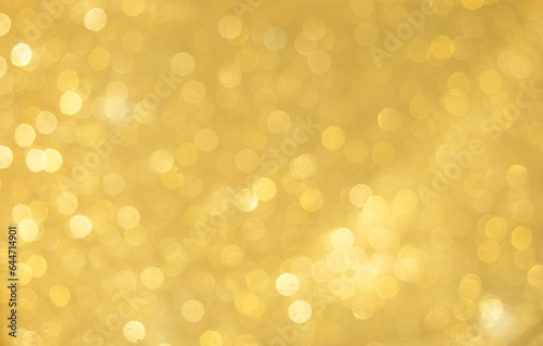 Gold bokeh background with luxury glitter golden bokeh light for background, wallpaper and web template design, blurred Christmas celebration light