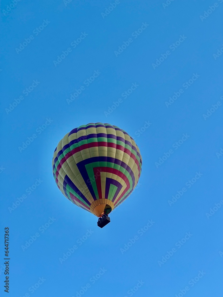 hot air balloon in flight with blue sky. hot air balloon in flight with blue sky.