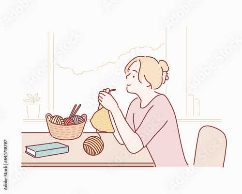  happy woman knits with knitted sweater in yellow color with threads of natural wool. Hand drawn style vector design illustrations.